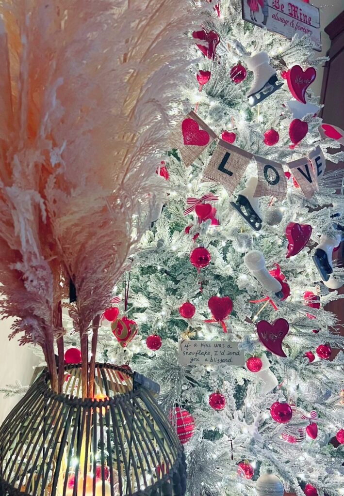 Valentine's Day tree with hearts and wicker basket with faux pink and cream Pampas grass. 