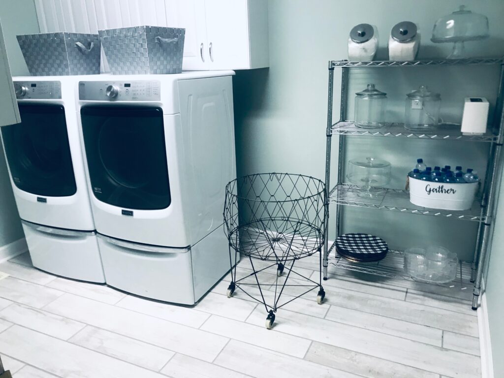 Laundry Room Makover After Picture with new flooring and picture with washer and dryer