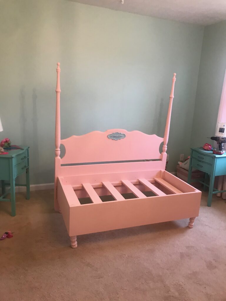 DIY painted pink with aqua detail headboard and frame.